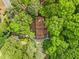 Aerial view of a home surrounded by tall green trees at 475 Nottingham Dr, Marietta, GA 30066