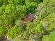 Aerial view of wooded home surrounded by green lush trees at 475 Nottingham Dr, Marietta, GA 30066