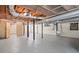 Unfinished basement with exposed ceiling, pipes, and concrete floor at 475 Nottingham Dr, Marietta, GA 30066