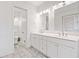 Bright bathroom with double vanity, modern fixtures, and separate toilet room at 475 Nottingham Dr, Marietta, GA 30066