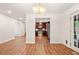 Bright dining room with hardwood floors and a view into the kitchen with stainless steel appliances at 475 Nottingham Dr, Marietta, GA 30066