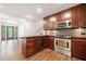 Spacious kitchen area with a view to the front entry and updated appliances and granite countertops at 475 Nottingham Dr, Marietta, GA 30066