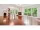 Open concept living room features a fireplace, access to an outside balcony, and adjacent bathroom at 475 Nottingham Dr, Marietta, GA 30066