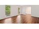 Bright living room with hardwood floors and large windows offering great natural light and wooded view at 475 Nottingham Dr, Marietta, GA 30066