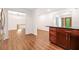 Open-concept living room with hardwood floors, a view to the front door, and adjacent dining space at 475 Nottingham Dr, Marietta, GA 30066