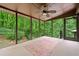 A bare screened porch has ceiling fan and a beautiful view of the natural beauty outside at 475 Nottingham Dr, Marietta, GA 30066