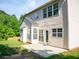A well-maintained home backyard featuring a patio and large windows for ample natural light at 663 Prada Ct, Lawrenceville, GA 30043