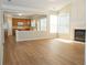 Spacious living room featuring a fireplace and an open view to the kitchen at 663 Prada Ct, Lawrenceville, GA 30043