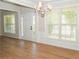 Bright living room features new flooring, crown molding, and large windows at 663 Prada Ct, Lawrenceville, GA 30043