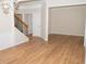Bright living room features new flooring, crown molding, and is located near staircase at 663 Prada Ct, Lawrenceville, GA 30043
