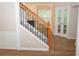 Classic staircase with wood and iron accents and modern plank flooring at 663 Prada Ct, Lawrenceville, GA 30043