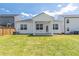 Well-maintained backyard with lush lawn and a covered porch, perfect for outdoor activities at 2010 Vidalia Ct, Dacula, GA 30019
