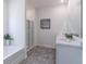 Modern bathroom with a bathtub, separate shower, and a dual sink vanity at 2010 Vidalia Ct, Dacula, GA 30019