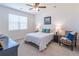 Comfortable bedroom with a large window, neutral colors, and stylish decor at 2010 Vidalia Ct, Dacula, GA 30019