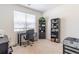 Home office with a rolling chair, large window, and plenty of shelving space at 2010 Vidalia Ct, Dacula, GA 30019