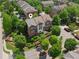 Aerial view of townhomes surrounded by lush greenery in a landscaped community at 2020 Jardin Ct, Alpharetta, GA 30022