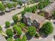 Aerial view showcasing a beautifully landscaped townhome community with mature trees at 2020 Jardin Ct, Alpharetta, GA 30022