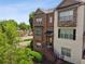 Beautiful multi-story townhome featuring brick and stone accents, along with manicured landscaping at 2020 Jardin Ct # 1, Alpharetta, GA 30022