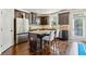 Modern kitchen featuring stainless steel appliances, granite countertops, and hardwood floors at 2020 Jardin Ct, Alpharetta, GA 30022