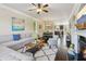 Spacious open concept living area with hardwood floors, fireplace, and ample seating at 2020 Jardin Ct, Alpharetta, GA 30022