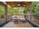Inviting covered back porch with comfortable seating and ceiling fan at 615 Sycamore Dr, Decatur, GA 30030