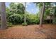 Enjoy the spacious backyard, surrounded by lush greenery and mature trees at 615 Sycamore Dr, Decatur, GA 30030