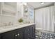 Bathroom featuring a double vanity, patterned tile floors, and shower with curtain at 615 Sycamore Dr, Decatur, GA 30030