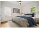 Bedroom with hardwood floors and plentiful natural light with simple decor at 615 Sycamore Dr, Decatur, GA 30030