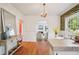 Bright dining area features a decorative wallpapered wall and hardwood flooring at 615 Sycamore Dr, Decatur, GA 30030