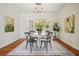 Dining room features hardwood flooring, overhead lighting, and natural light from backyard at 615 Sycamore Dr, Decatur, GA 30030
