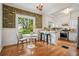 Bright kitchen with stainless steel appliances, patterned wallpaper, and breakfast nook at 615 Sycamore Dr, Decatur, GA 30030
