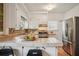 Well-equipped kitchen featuring tile countertops and stainless steel appliances at 615 Sycamore Dr, Decatur, GA 30030