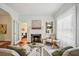Cozy living room with fireplace, hardwood floors, and lots of natural light at 615 Sycamore Dr, Decatur, GA 30030