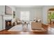 Cozy living room with fireplace, hardwood floors, and neutral furnishings at 615 Sycamore Dr, Decatur, GA 30030