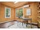 Bright outbuilding office features wood floors, natural light, and an efficient mini split system at 615 Sycamore Dr, Decatur, GA 30030