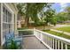 Inviting covered front porch with white railings and a cozy bench at 615 Sycamore Dr, Decatur, GA 30030