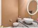 Stylish half bathroom with a sleek vessel sink and granite countertop at 7324 Bridlewood Ct, Jonesboro, GA 30236