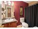 Bathroom featuring vanity and toilet with contrasting colors at 7324 Bridlewood Ct, Jonesboro, GA 30236