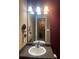 Bathroom features a sleek vanity, modern lighting, and an expansive mirror at 7324 Bridlewood Ct, Jonesboro, GA 30236