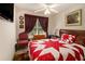 Bedroom featuring a decorative quilt, ceiling fan, and natural lighting at 7324 Bridlewood Ct, Jonesboro, GA 30236