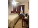 Comfortable bedroom featuring a ceiling fan, a cozy bed, and a functional workspace at 7324 Bridlewood Ct, Jonesboro, GA 30236