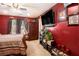 Cozy bedroom with a ceiling fan, large TV, and ample space for relaxation at 7324 Bridlewood Ct, Jonesboro, GA 30236