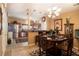 Inviting dining area flowing into an open kitchen, complete with stylish furnishings and modern appliances at 7324 Bridlewood Ct, Jonesboro, GA 30236