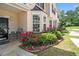 Charming townhome with curb appeal, featuring lovely landscaping, a well-manicured lawn and ample parking at 7324 Bridlewood Ct, Jonesboro, GA 30236