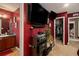 Hallway featuring entertainment center, closet, and view into the bathroom and bedroom at 7324 Bridlewood Ct, Jonesboro, GA 30236