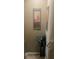Upstairs hallway with artwork, carpet and decorative plants at 7324 Bridlewood Ct, Jonesboro, GA 30236