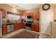 Well-equipped kitchen with stainless steel appliances, granite countertops, and ample cabinet space at 7324 Bridlewood Ct, Jonesboro, GA 30236