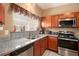 Well-equipped kitchen featuring granite countertops and stainless steel appliances at 7324 Bridlewood Ct, Jonesboro, GA 30236