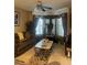 Cozy living room features a large sectional sofa and decorative curtains at 7324 Bridlewood Ct, Jonesboro, GA 30236
