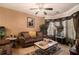 Inviting living room with comfortable brown sofa, decorative rug, and natural light at 7324 Bridlewood Ct, Jonesboro, GA 30236